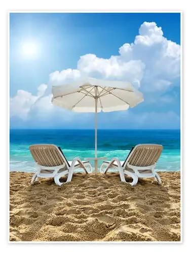 Beach chair and white umbrella on sand beach Editors Choice