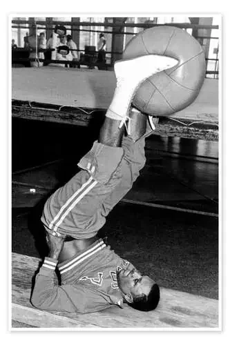 Joe Frazier during training with a medicine ball Everett Collection